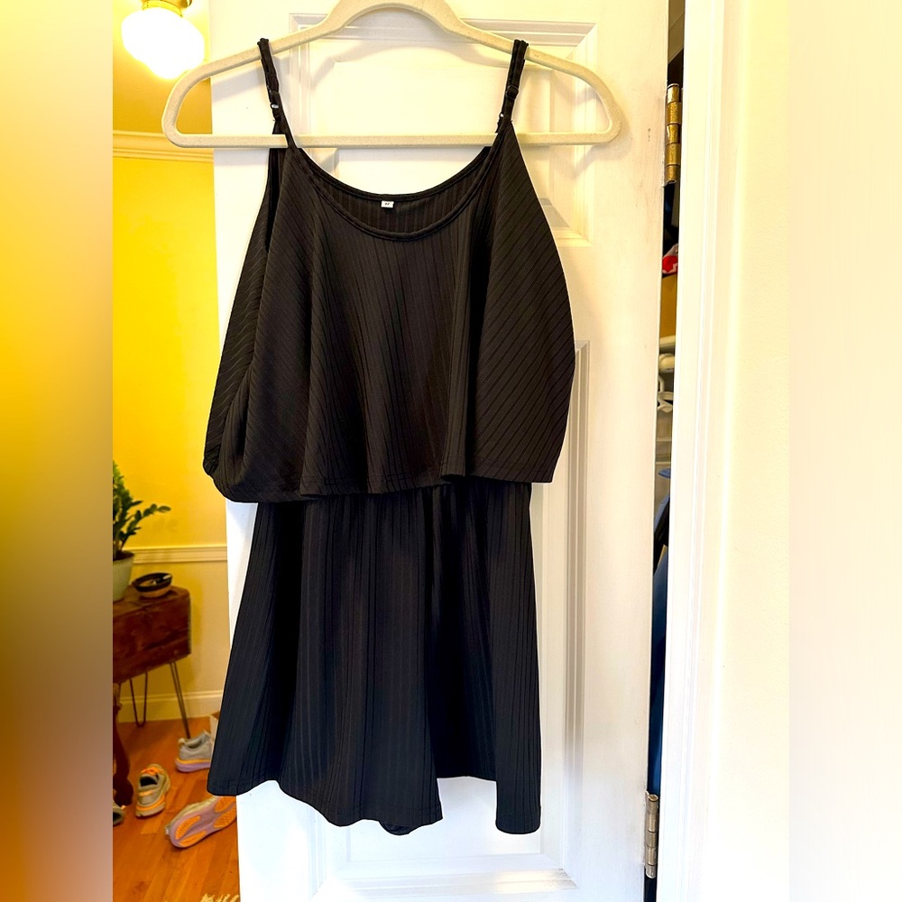 BRAND NEW Black romper, feels like satin, very stretchy.